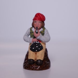 Homme à la pipe assis